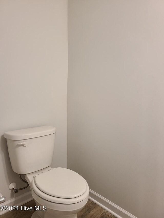 460 Maides Ave, Wilmington, NC 28405 - bathroom featuring toilet, baseboards, and wood finished floors