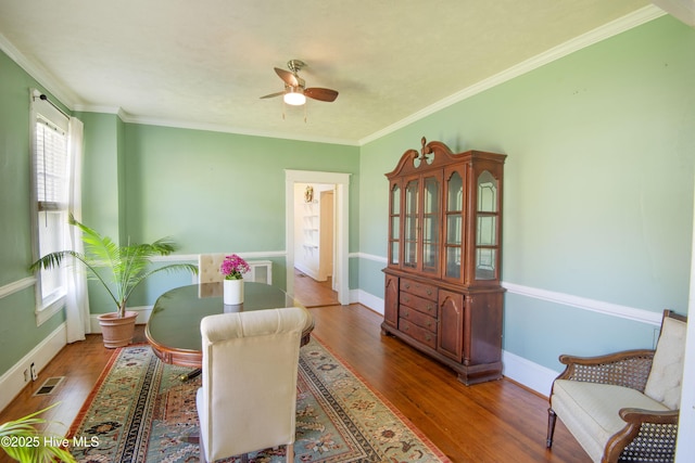 915 Saint David St, Tarboro, NC 27886 - dining space featuring wood finished floors, visible vents, a ceiling fan, and ornamental molding