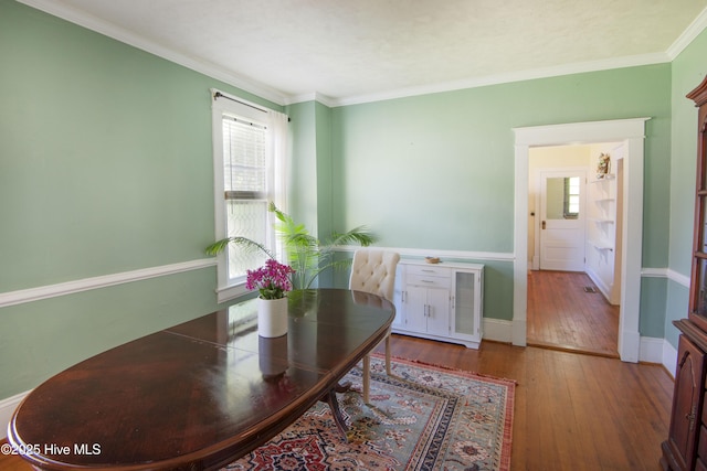 915 Saint David St, Tarboro, NC 27886 - dining area with crown molding and hardwood / wood-style flooring