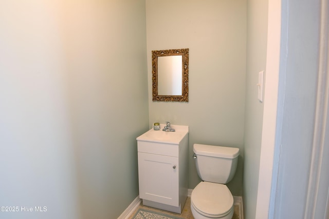 915 Saint David St, Tarboro, NC 27886 - bathroom with baseboards, vanity, and toilet
