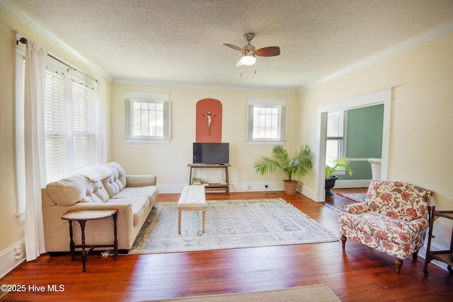 915 Saint David St, Tarboro, NC 27886 - living room with wood-type flooring, a healthy amount of sunlight, and crown molding