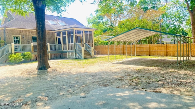 3772 Old Maco Rd NE, Leland, NC 28451 - view of yard with fence, a sunroom, stairway, a carport, and driveway