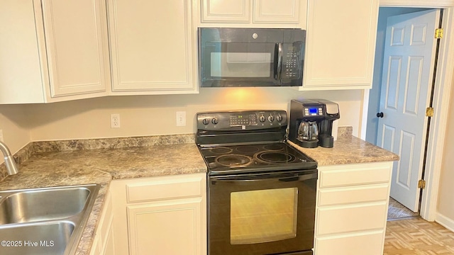 3772 Old Maco Rd NE, Leland, NC 28451 - kitchen featuring white cabinets, a sink, and black appliances