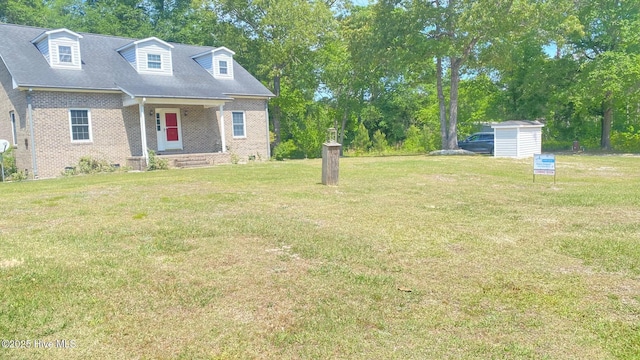 3772 Old Maco Rd NE, Leland, NC 28451 - view of yard with a storage unit and an outbuilding