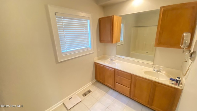 3772 Old Maco Rd NE, Leland, NC 28451 - bathroom featuring visible vents, double vanity, baseboards, tile patterned floors, and a sink