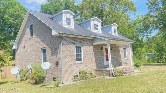 3772 Old Maco Rd NE, Leland, NC 28451 - view of front facade featuring covered porch, a front yard, and brick siding