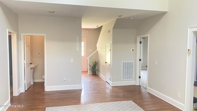 3772 Old Maco Rd NE, Leland, NC 28451 - spare room featuring baseboards, visible vents, and wood finished floors