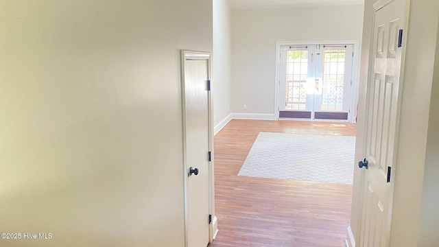 3772 Old Maco Rd NE, Leland, NC 28451 - hallway featuring french doors, baseboards, and wood finished floors