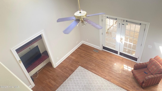 3772 Old Maco Rd NE, Leland, NC 28451 - unfurnished living room with french doors, a ceiling fan, baseboards, wood finished floors, and visible vents