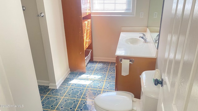 3772 Old Maco Rd NE, Leland, NC 28451 - half bathroom with toilet, tile patterned floors, baseboards, and vanity