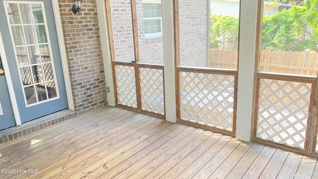 3772 Old Maco Rd NE, Leland, NC 28451 - unfurnished sunroom featuring wood-type flooring and a deck
