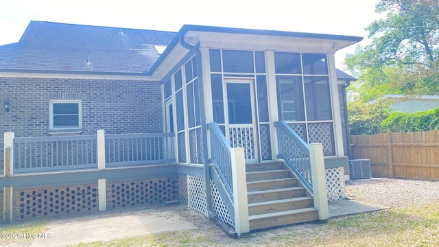 3772 Old Maco Rd NE, Leland, NC 28451 - back of property featuring brick siding, central AC, fence, and a sunroom