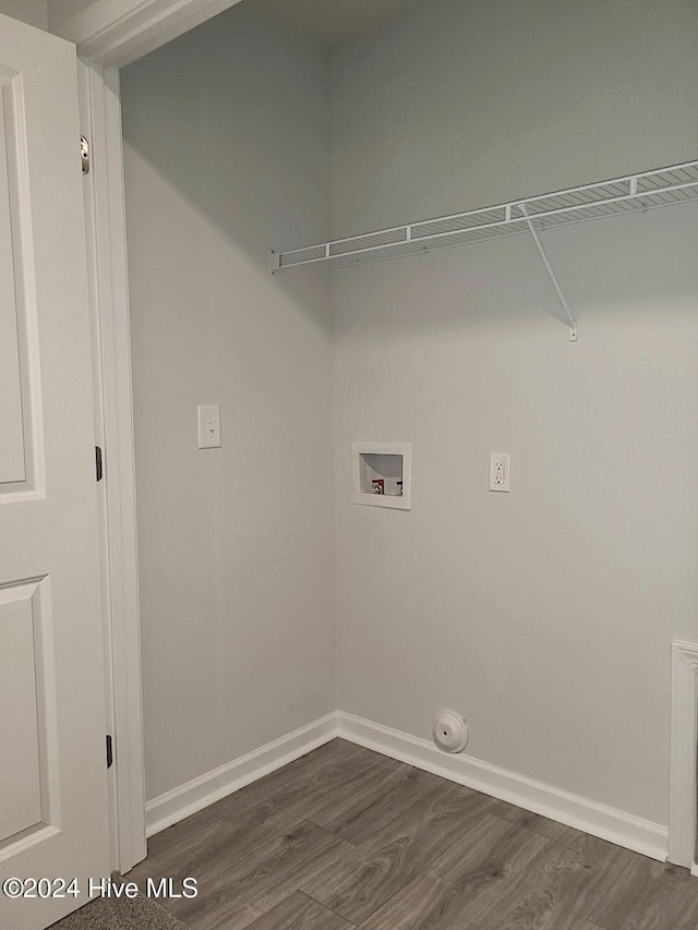 laundry room featuring baseboards, laundry area, washer hookup, and dark wood finished floors