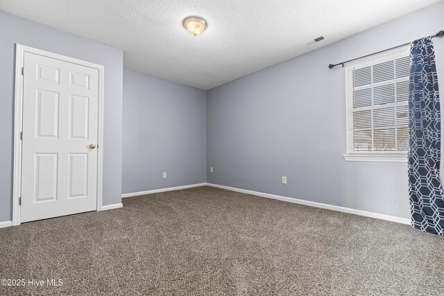 110 Vauhan Ct, Jacksonville, NC 28540 - unfurnished bedroom featuring carpet floors, a textured ceiling, visible vents, and baseboards