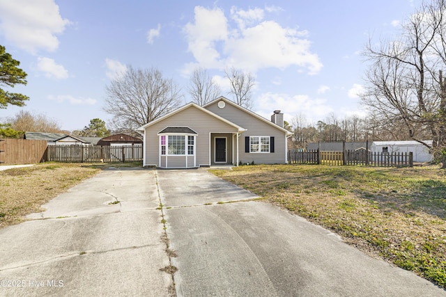 110 Vauhan Ct, Jacksonville, NC 28540 - bungalow featuring a chimney, a front lawn, fence, and concrete driveway
