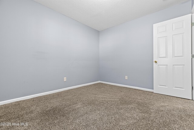 110 Vauhan Ct, Jacksonville, NC 28540 - spare room featuring carpet floors, a textured ceiling, and baseboards