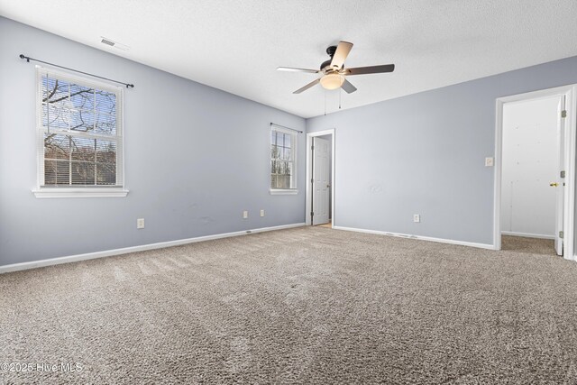 110 Vauhan Ct, Jacksonville, NC 28540 - interior space featuring baseboards, visible vents, a textured ceiling, and ceiling fan