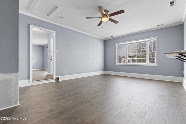 110 Vauhan Ct, Jacksonville, NC 28540 - unfurnished living room with ornamental molding, visible vents, ceiling fan, and dark wood-style flooring