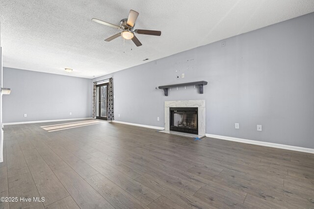 110 Vauhan Ct, Jacksonville, NC 28540 - unfurnished living room featuring a premium fireplace, baseboards, a textured ceiling, and ceiling fan