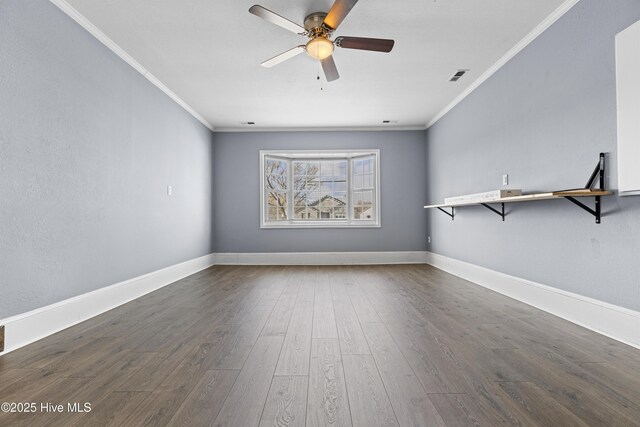 110 Vauhan Ct, Jacksonville, NC 28540 - empty room featuring dark wood-type flooring, visible vents, crown molding, and a ceiling fan