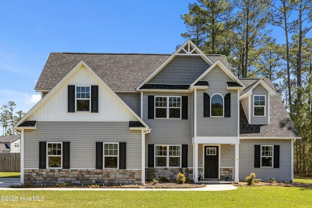 500 Maggies Ct, Jacksonville, NC 28540 - craftsman house with stone siding, a shingled roof, fence, and a front yard