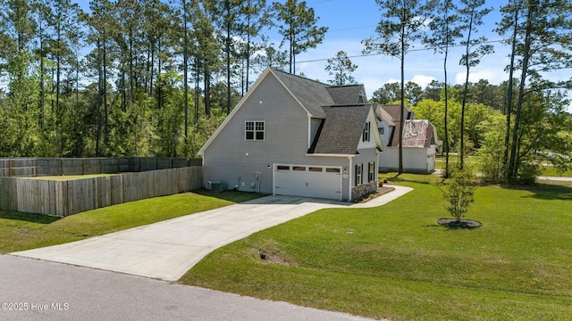 500 Maggies Ct, Jacksonville, NC 28540 - view of side of home featuring concrete driveway, a lawn, fence, a garage, and roof with shingles