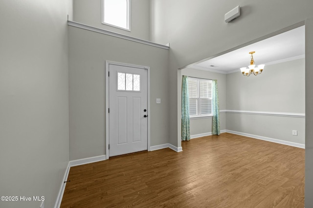 500 Maggies Ct, Jacksonville, NC 28540 - foyer with crown molding, baseboards, a notable chandelier, and wood finished floors