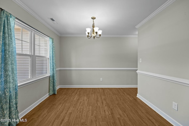 500 Maggies Ct, Jacksonville, NC 28540 - empty room featuring a chandelier, wood finished floors, visible vents, and baseboards