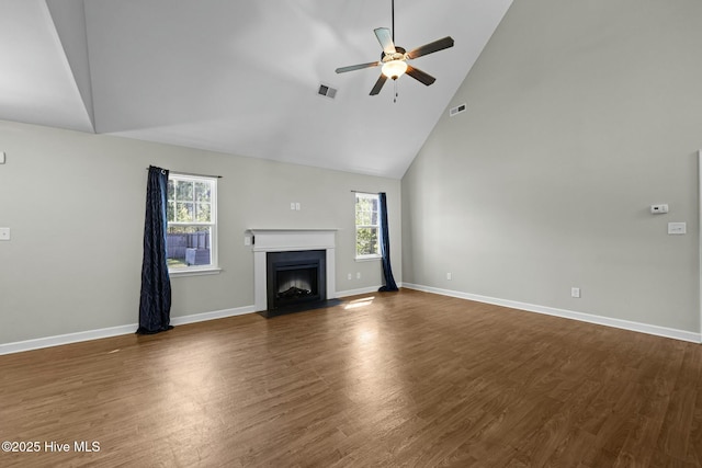 500 Maggies Ct, Jacksonville, NC 28540 - unfurnished living room with high vaulted ceiling, ceiling fan, a fireplace with flush hearth, and visible vents