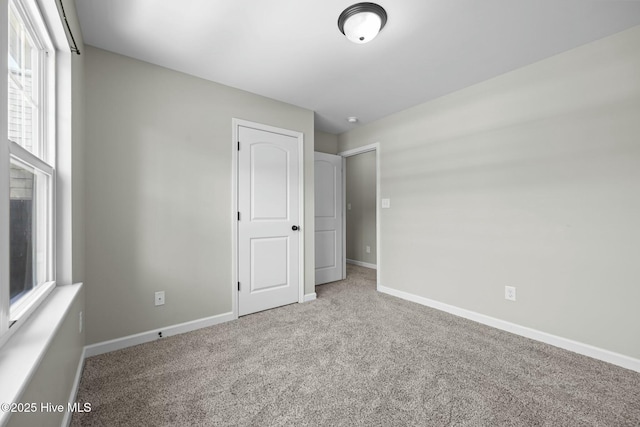 500 Maggies Ct, Jacksonville, NC 28540 - unfurnished bedroom featuring carpet flooring, baseboards, and multiple windows