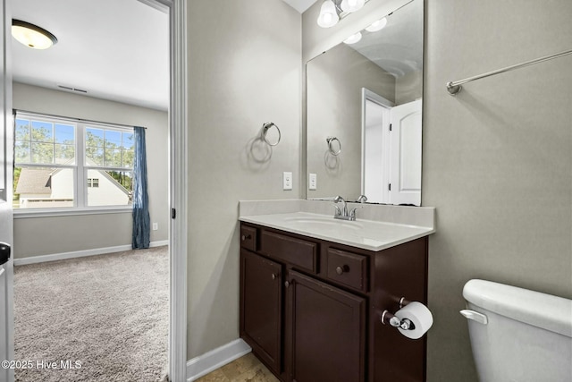 500 Maggies Ct, Jacksonville, NC 28540 - half bathroom featuring baseboards, toilet, and vanity