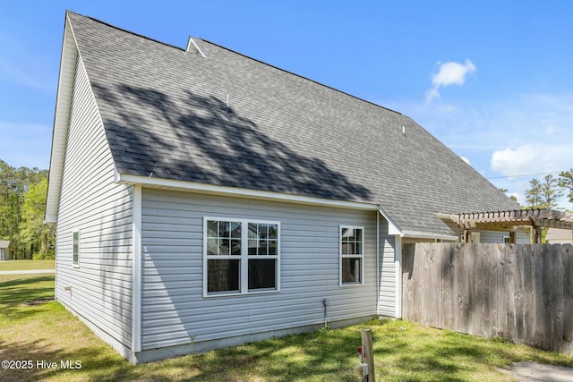 500 Maggies Ct, Jacksonville, NC 28540 - rear view of property featuring a pergola, a yard, a shingled roof, and fence
