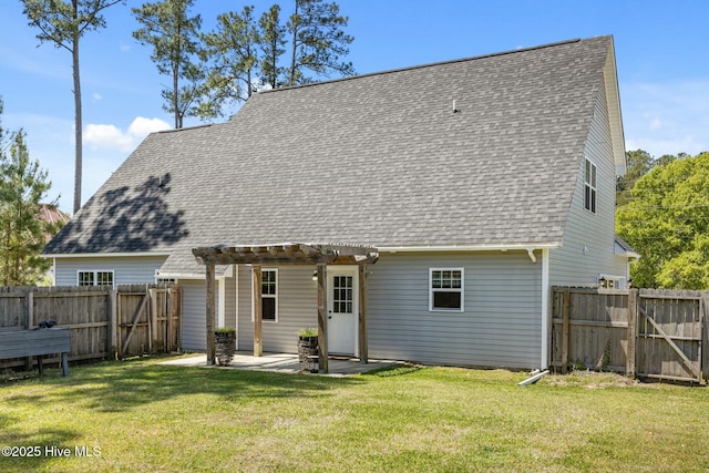 500 Maggies Ct, Jacksonville, NC 28540 - back of property featuring a fenced backyard, a pergola, a shingled roof, a yard, and a patio