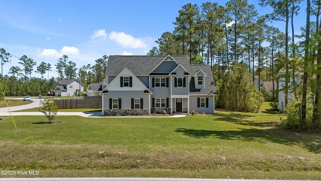 500 Maggies Ct, Jacksonville, NC 28540 - view of front of home with stone siding, a front lawn, and fence