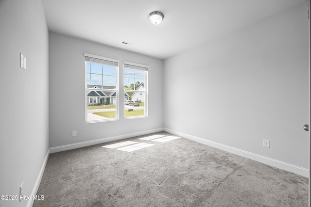 260 E Red Head Cir, Sneads Ferry, NC 28460 - spare room featuring visible vents, carpet flooring, and baseboards