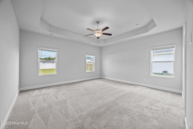 260 E Red Head Cir, Sneads Ferry, NC 28460 - carpeted spare room featuring a raised ceiling, visible vents, a ceiling fan, and baseboards