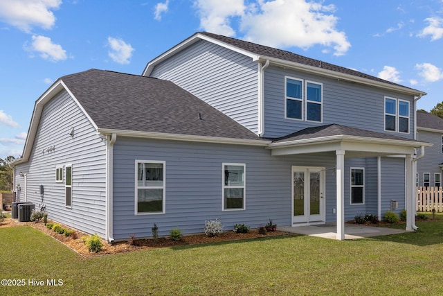 260 E Red Head Cir, Sneads Ferry, NC 28460 - rear view of house featuring fence, a patio area, a shingled roof, and a yard