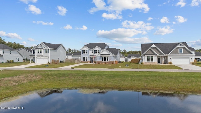 260 E Red Head Cir, Sneads Ferry, NC 28460 - view of front of house with an attached garage, driveway, a front yard, and a residential view