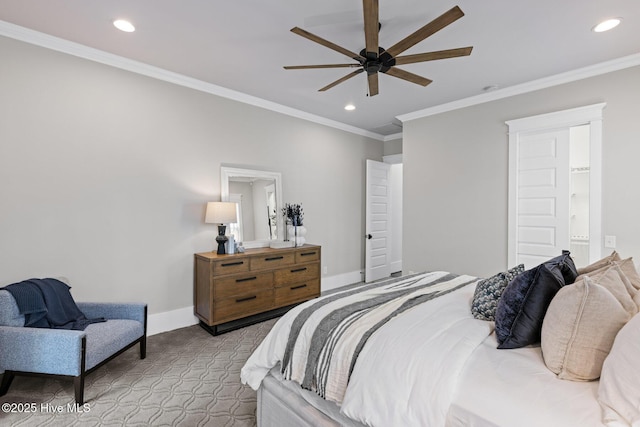 bedroom with recessed lighting, baseboards, ornamental molding, and ensuite bathroom