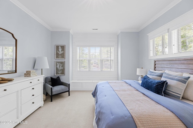 bedroom with ornamental molding and multiple windows