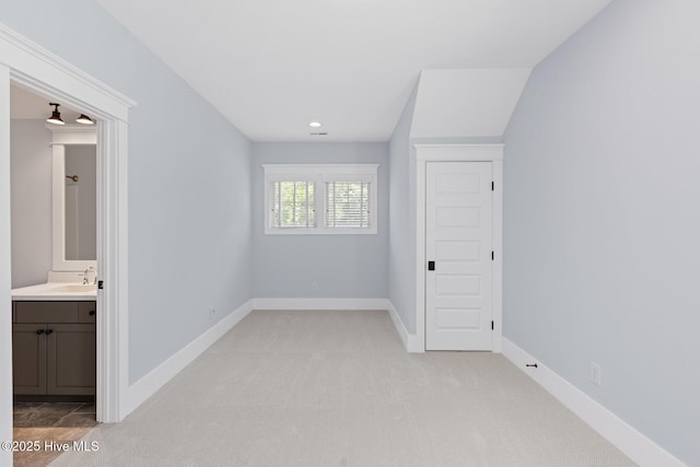 bathroom featuring wood finished floors and baseboards