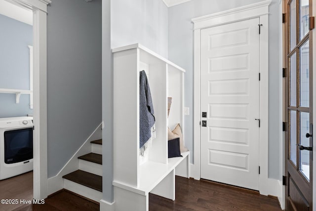 doorway to property featuring a garage and decorative driveway