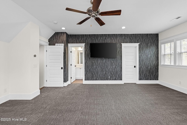 unfurnished living room featuring plenty of natural light, baseboards, ceiling fan, and carpet flooring