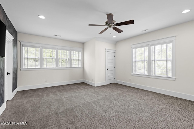 interior space featuring recessed lighting, carpet floors, visible vents, and baseboards