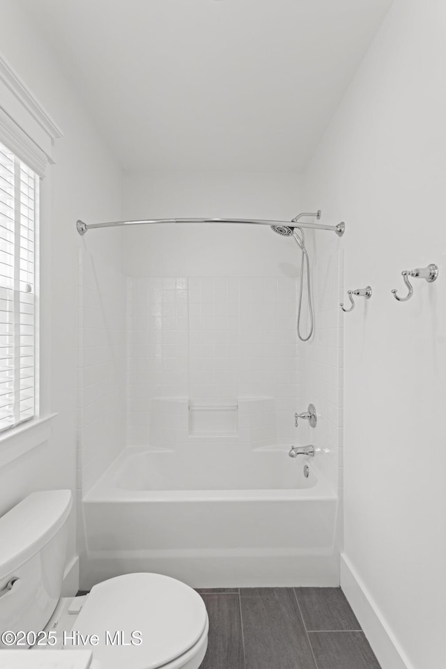 bathroom featuring a healthy amount of sunlight, vanity, and toilet
