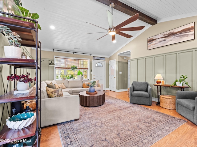 433 Dion Dr, Hubert, NC 28539 - living area featuring crown molding, ceiling fan, lofted ceiling with beams, and a decorative wall