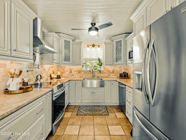 433 Dion Dr, Hubert, NC 28539 - kitchen with a sink, light countertops, stainless steel appliances, and wall chimney exhaust hood