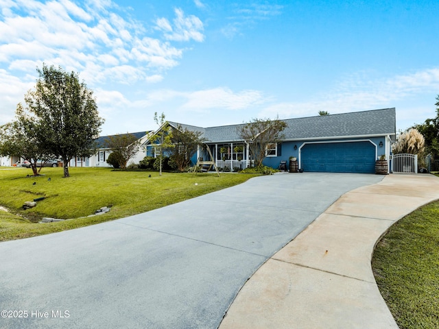 433 Dion Dr, Hubert, NC 28539 - ranch-style house with a garage, a gate, a front yard, and concrete driveway