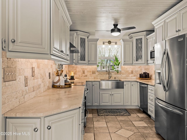 433 Dion Dr, Hubert, NC 28539 - kitchen with decorative backsplash, a sink, ventilation hood, a ceiling fan, and appliances with stainless steel finishes