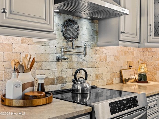 433 Dion Dr, Hubert, NC 28539 - kitchen featuring electric range, light countertops, ventilation hood, and backsplash
